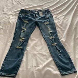 Size 10 XS Torrid Premium Stretch Bombshell Skinny Distressed Jeans.